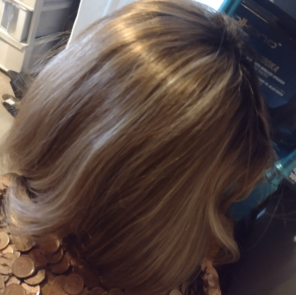 Dirty blonde wig shoulder length, lots of volume, you can part it any way
